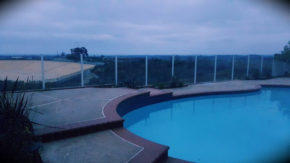 Frameless glass pool fence panels preserving the view