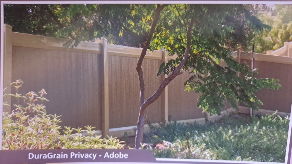 DuraGrain adobe-grain vinyl privacy fence with tan grain trim