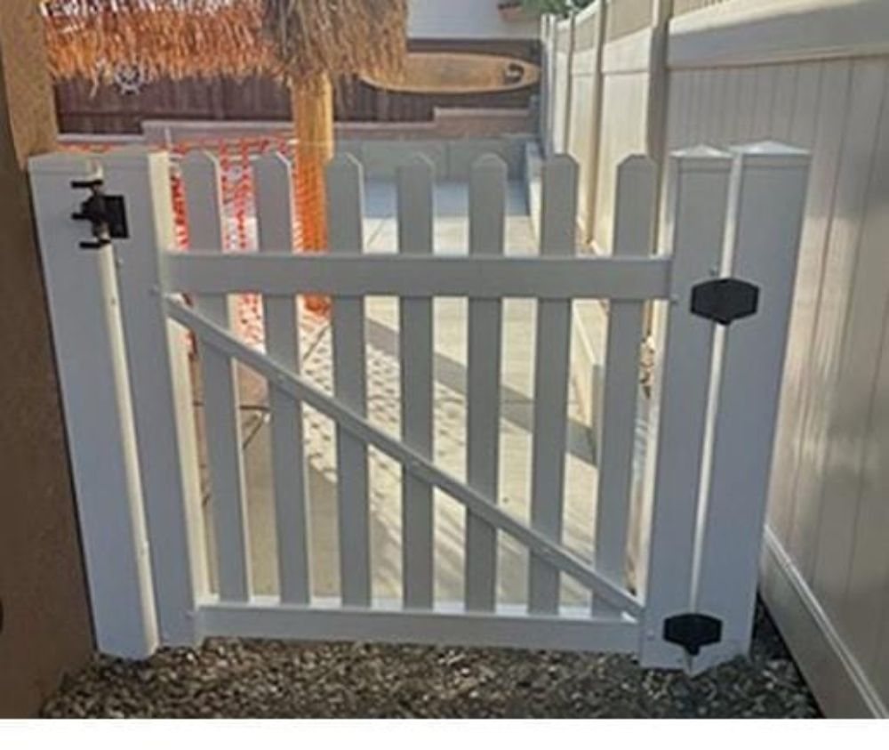 White vinyl picket gate with black hardware
